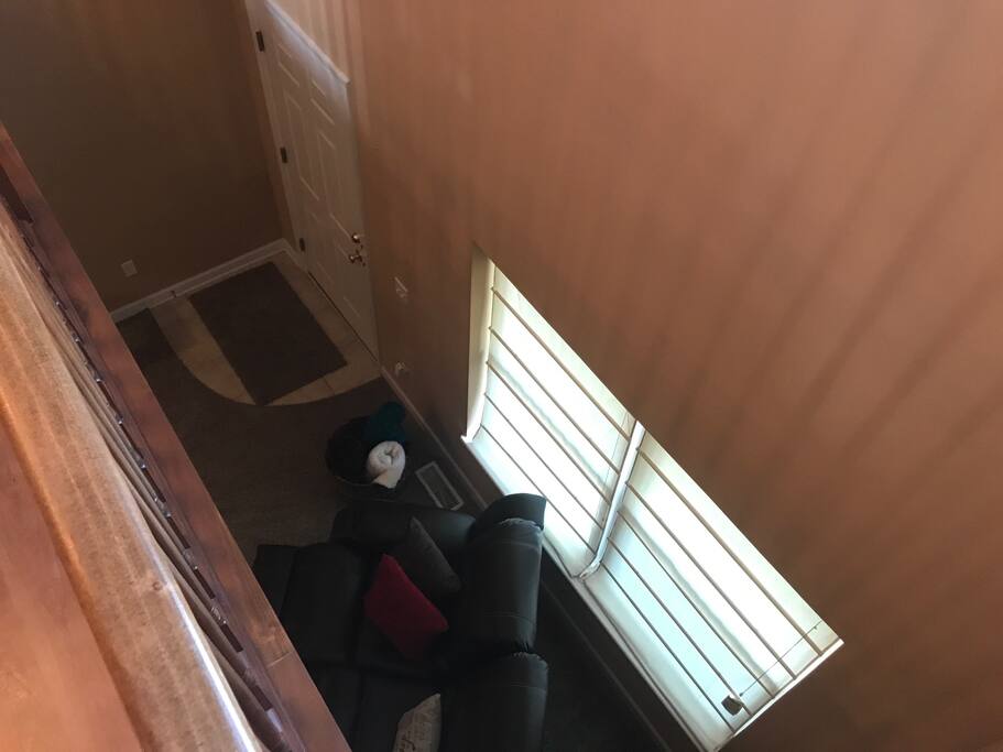 This view is from the dining/kitchen area looking down into the living room area.