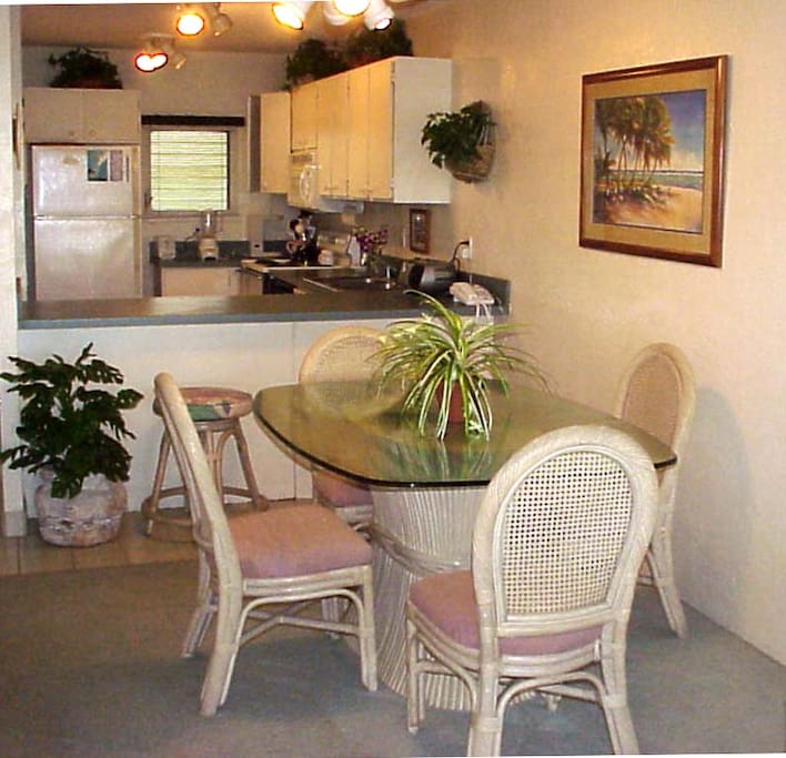 Dining room seats 4 guests and kitchen is full stocked with full size appliances and all the utensils to make a full meal.