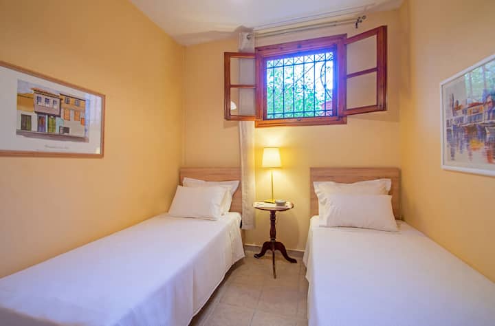 Bedroom 7 - Twin room, situated on the ground floor, two single beds, fan, closet