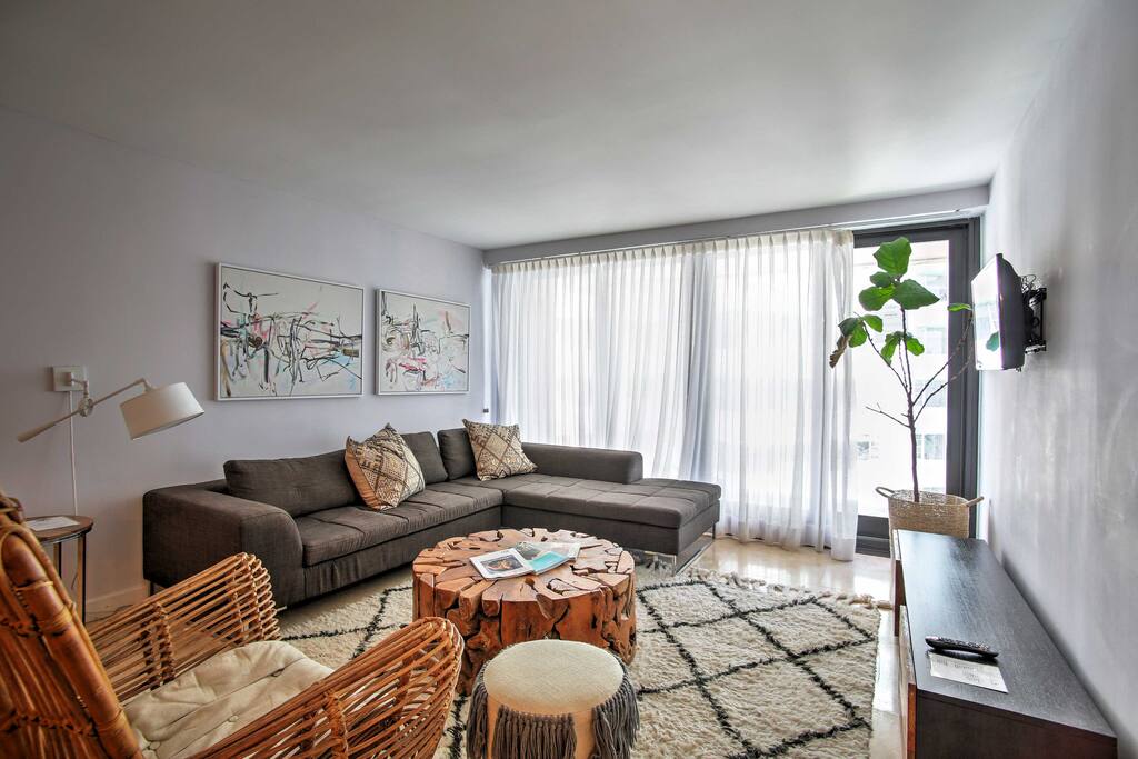 Make yourself at home by lounging on the comfortable sectional in the living area.