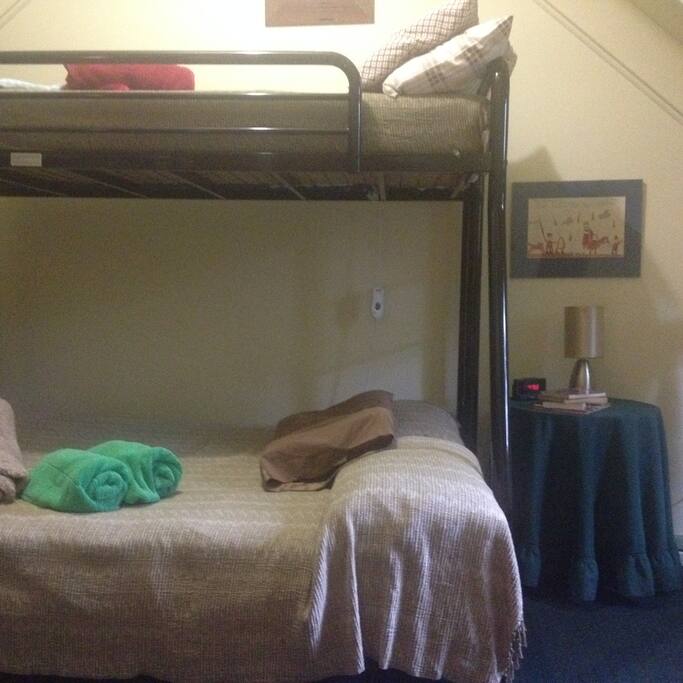 Loft bedroom. Double bed and single bunk.