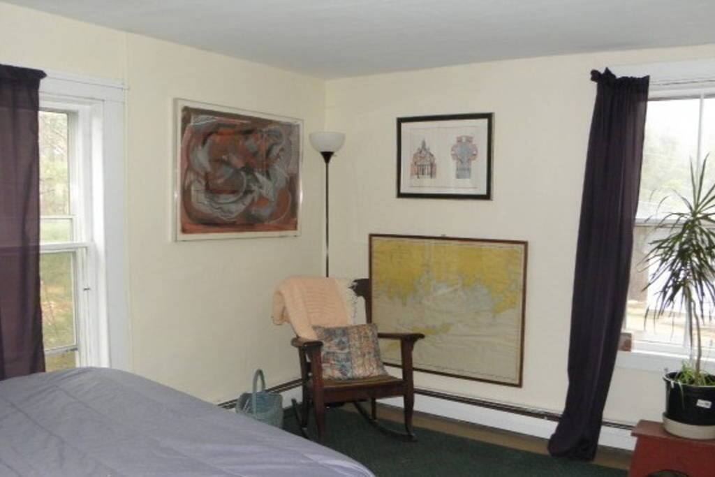 Larger bedroom with queen-size bed.
