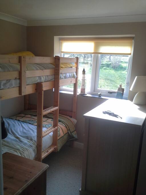 Bunk room overlooking garden with c/h, storage and individual lights for bunks