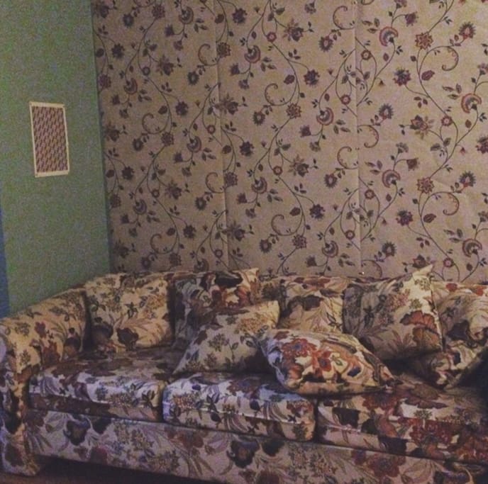 This sofa opens out in to a bed. it is extremely comfortable. the wallpaper matches the couch!