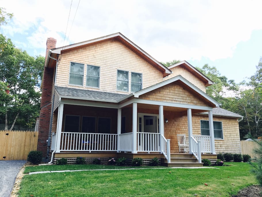 Beautiful new farm house with generous front porch.