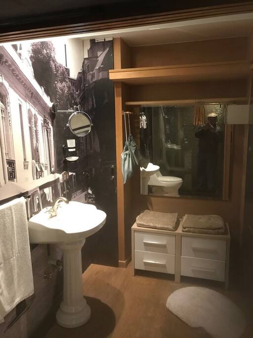 Bathroom with rainshower, hairdryer and closet space