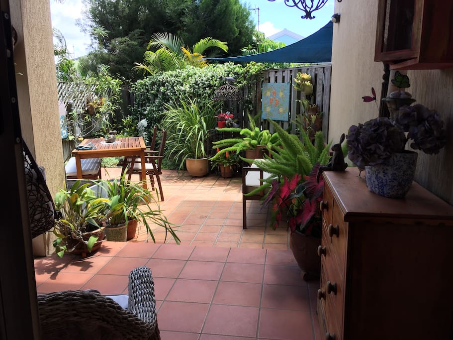 Patio/courtyard. As comfortable inside as out - hanging chair - lounge on the day bed or eat outdoors... decisions