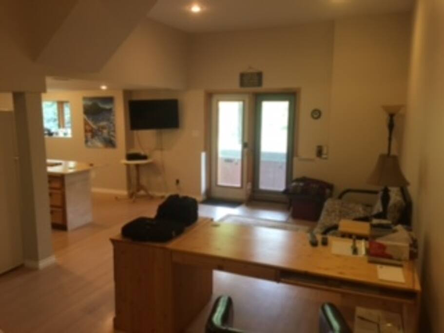 Lounge and desk area - double doors out to the backyard.