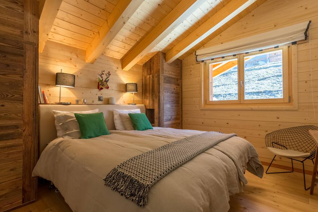 Elegant bedroom with twin beds next to your private lounge