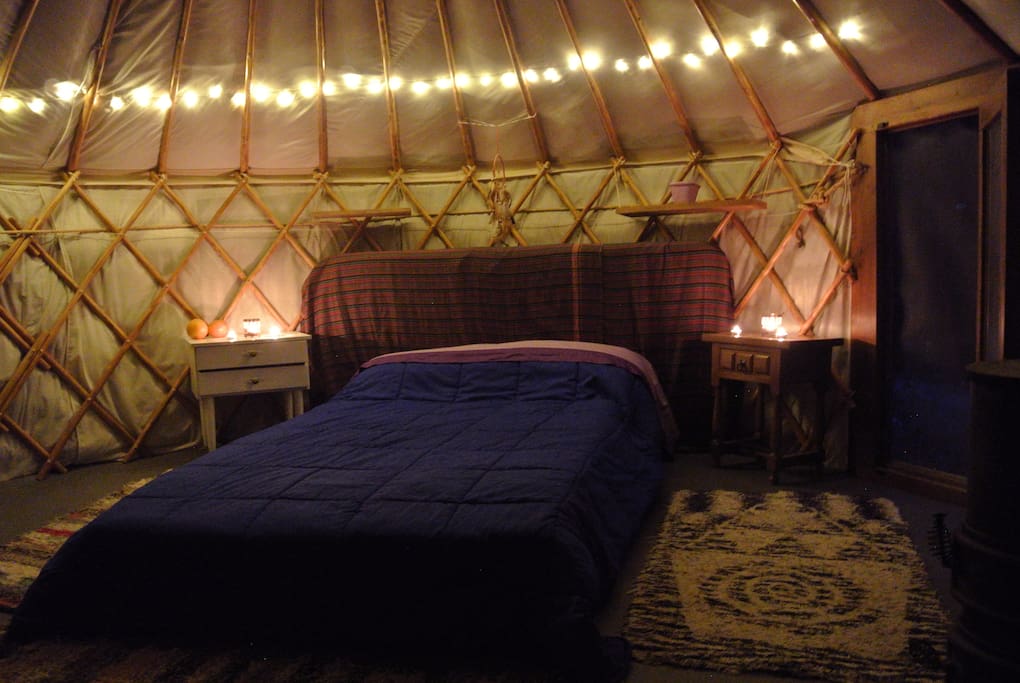 Lights inside the yurt. More rugs are added in winter - as is fire wood.