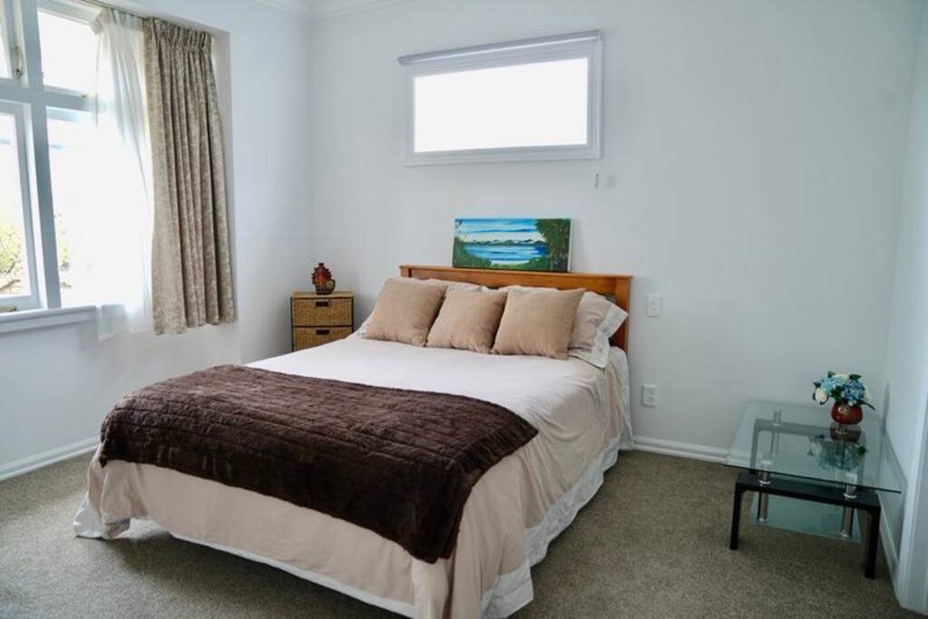 A comfortable queen size innerspring bed.