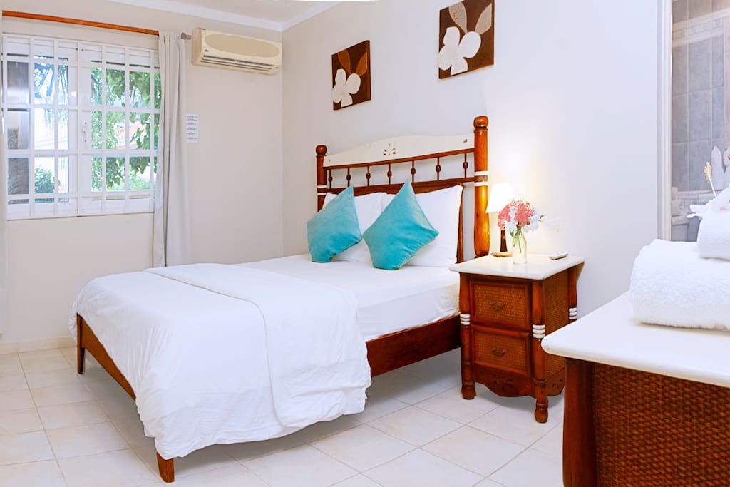 This is your spacious bedroom where you can chill out very well. Look at this beautiful design, you can use the night tables and dresser as your personal storage place.