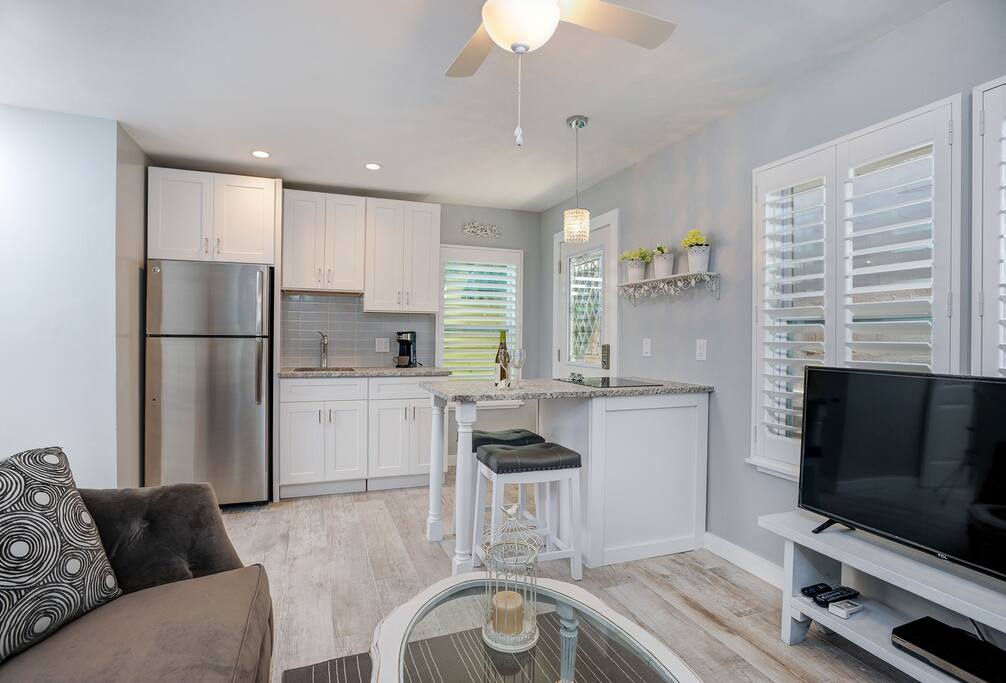 Living area opens to beautiful kitchen w/full size fridge and lots of cabinet space