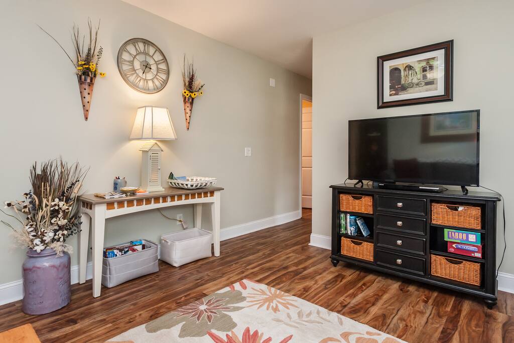 Hallway leads to main bath and bedrooms