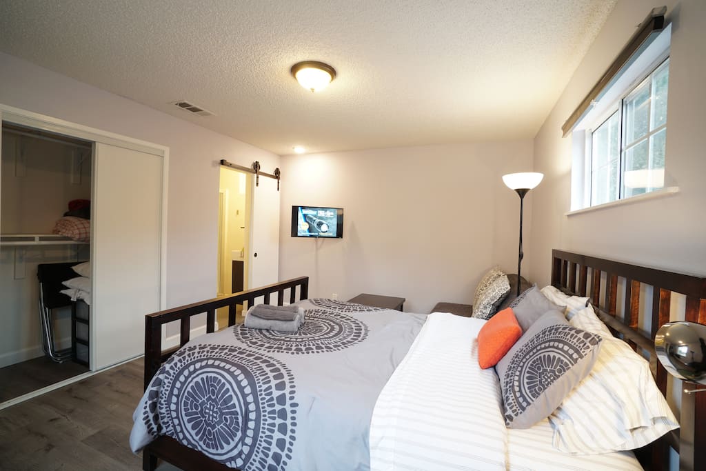 Ensuite Bathroom for privacy, Empty closet with extra sofa bed bedding, folding chairs
