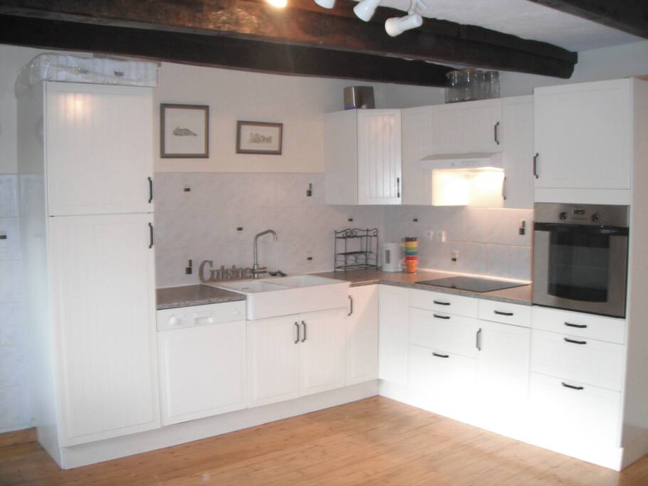 The well-equipped corner kitchen includes a dishwasher