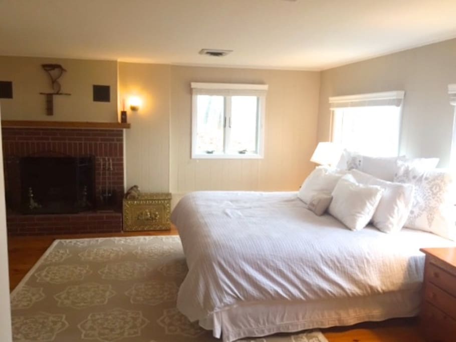 Suite #1 with king bed, full bathroom, and office