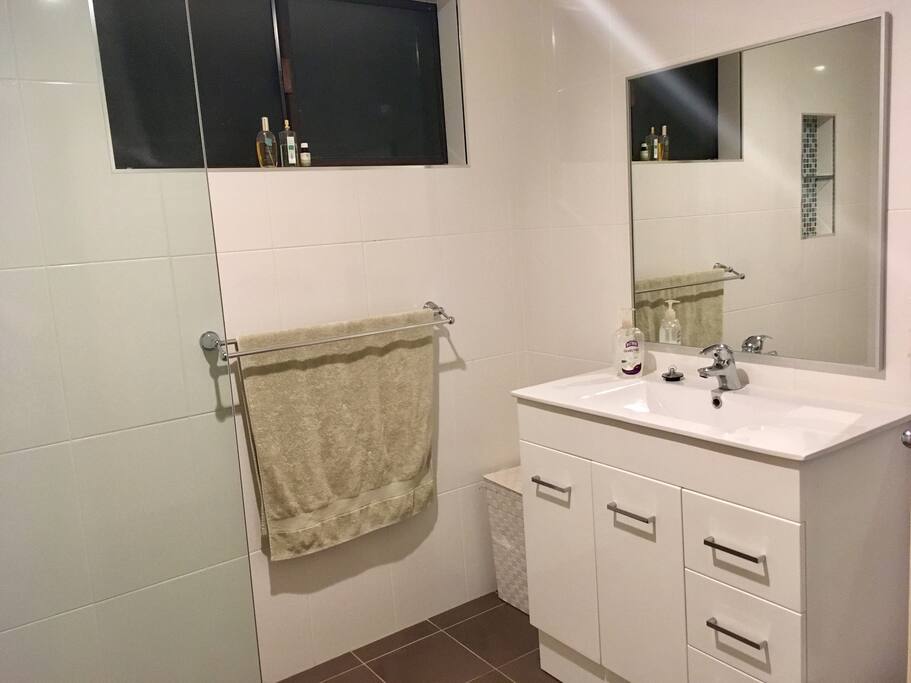We have a bright bathroom newly redone with an adjustable shower