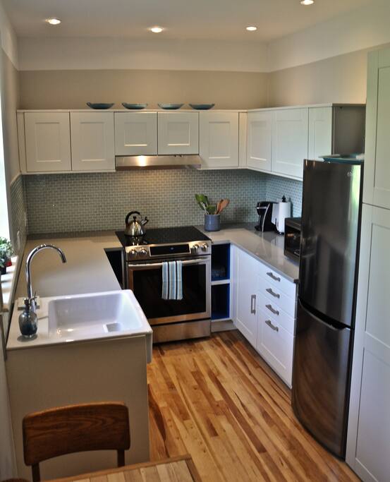New kitchen with SS dishwasher ,microwave, oven and fridge