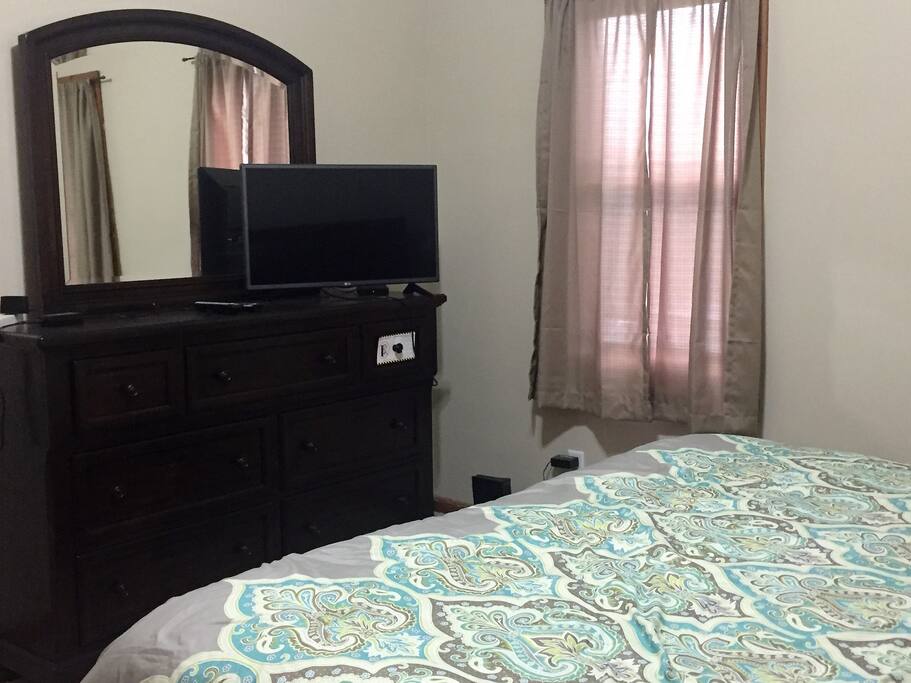 Bedroom dresser and flat screen TV
