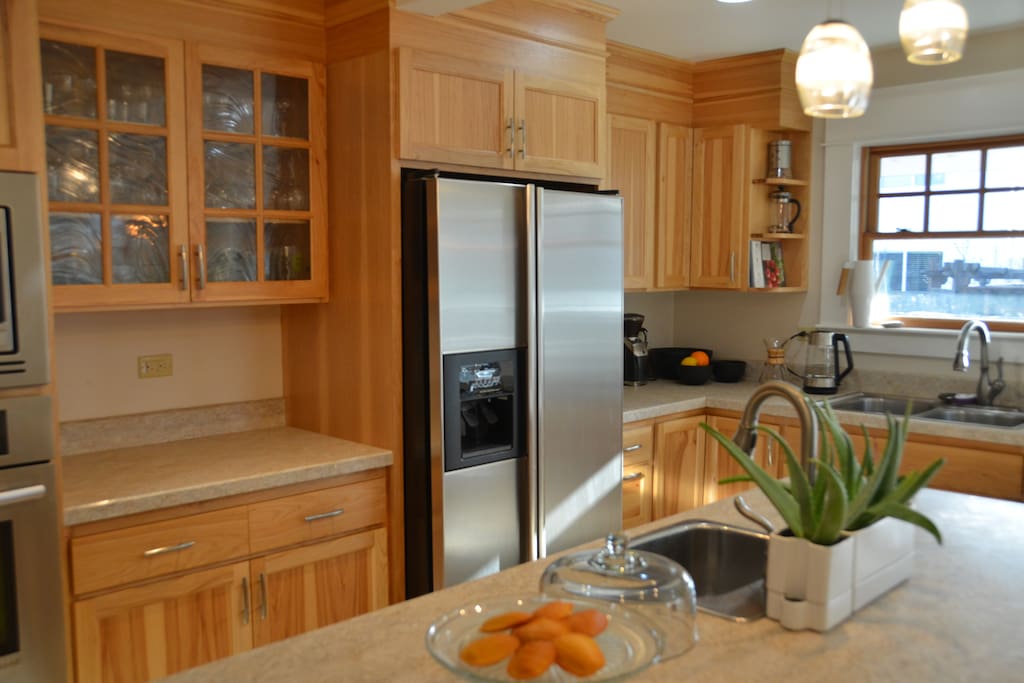 A spacious and bright kitchen with two ovens, island, and prep sink make this the ideal space for perfecting your recipes and entertaining.