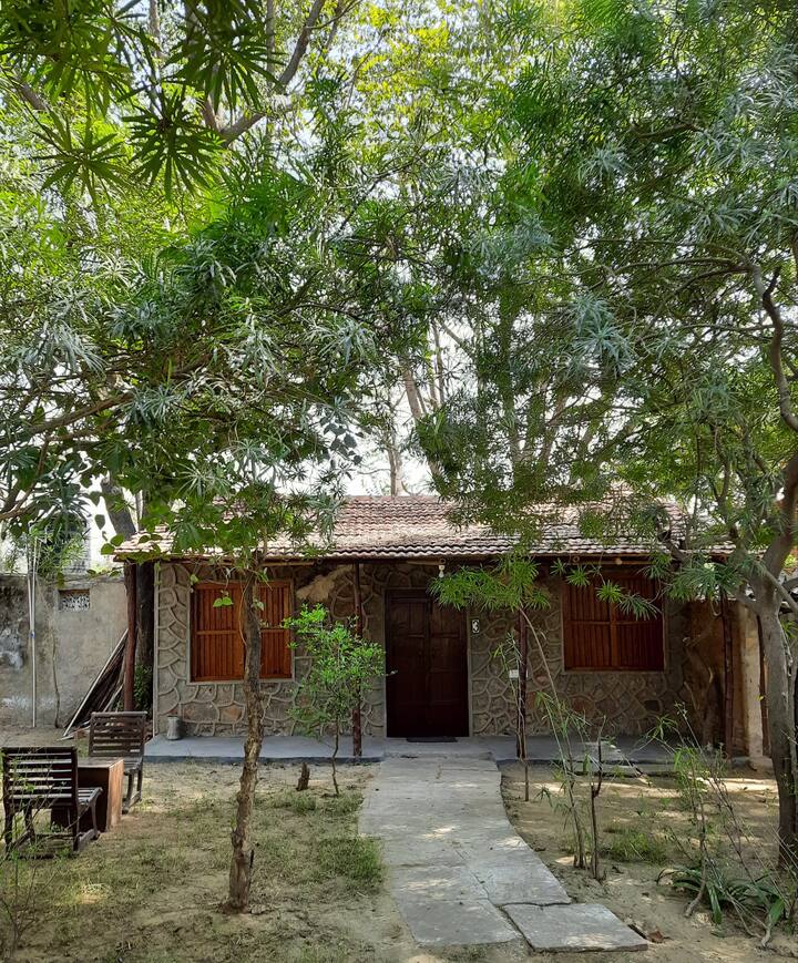 Stay with us in our rustic cottages, in the lap of nature.