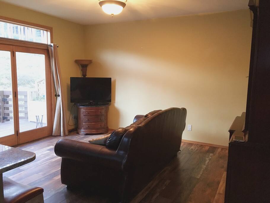 TV/living room continuous with kitchen.