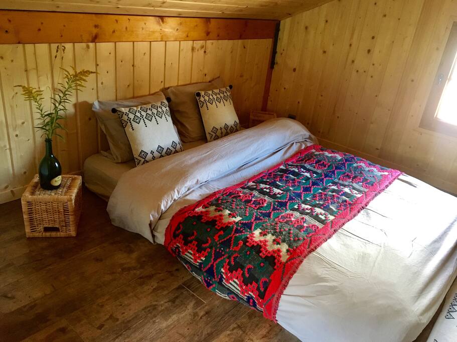 Cozy bedroom upstairs, with views of the mountains