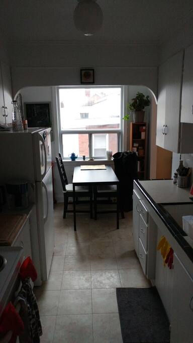 Small kitchen and table w/ 2 chairs