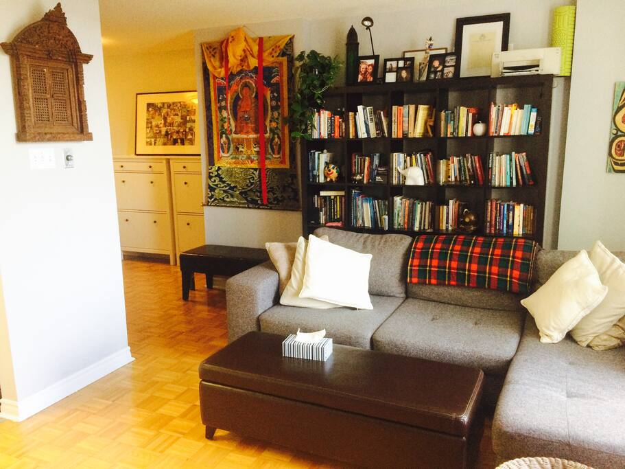 A sectional couch larger than a twin bed that will easily sleep one very tall person.