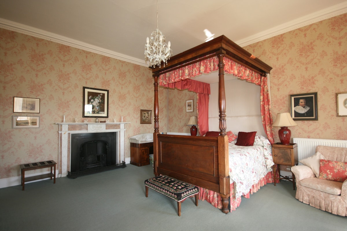 The Master bedroom a lovely bright room, with all the original furniture from the 1840s and beautiful views over the estate from the bay window.