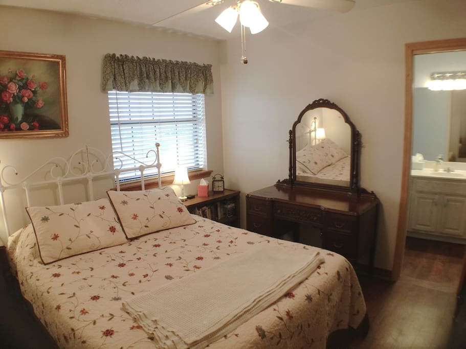 Queen Bed, door to full bathroom