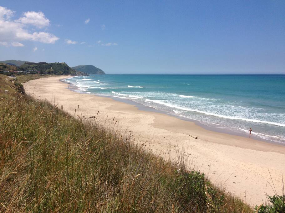 wainui beach looking north great sun swim and surf..