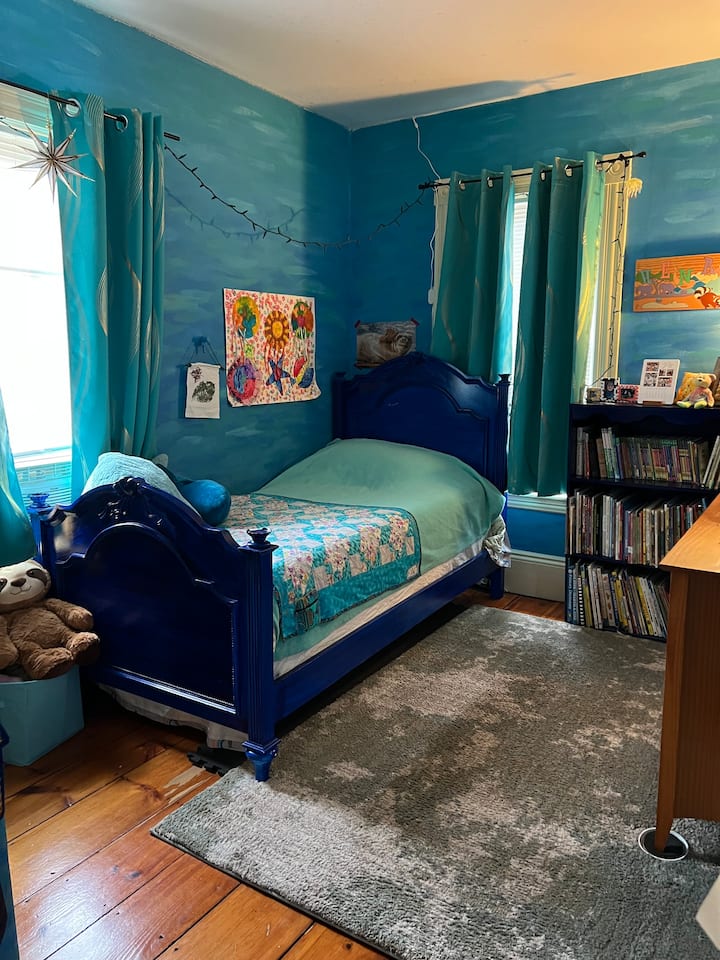 A great place for anyone 5-15 who loves to read! Lots of books in this underwater bedroom with a twin bed. 