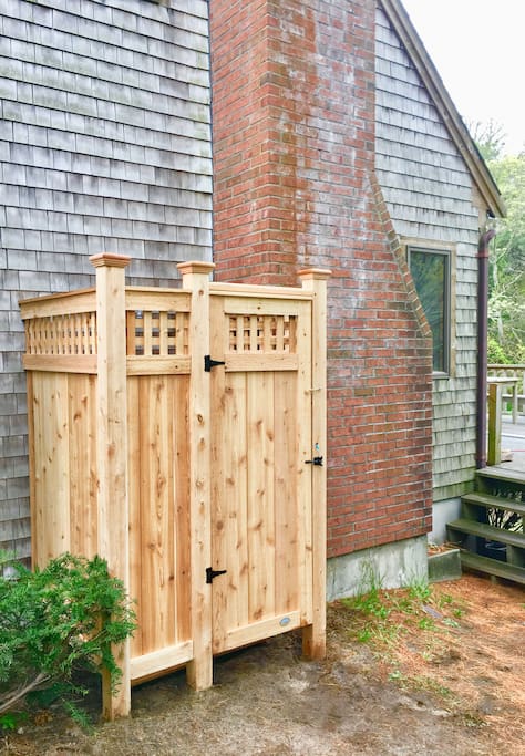 Custom Cape Cod outdoor shower with hot water