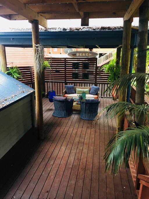 Outside front dec. Kid and Adult hang out. Evenings is a perfect time to chill out here when the kids are asleep!