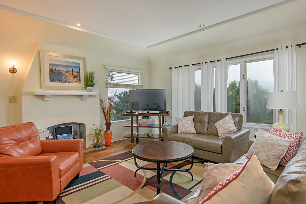 Plenty of seating around living room overlooking fantastic bayview