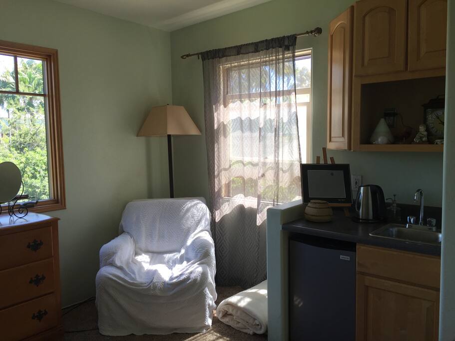 Bedroom--chair, mini-fridge, tea kettle, sink
