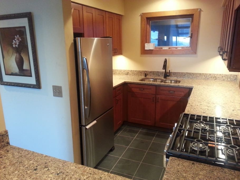 New upscale kitchen with cherry, slate, quartz