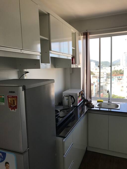 Kitchen which includes a fridge and some other basic stuffs that you may need.