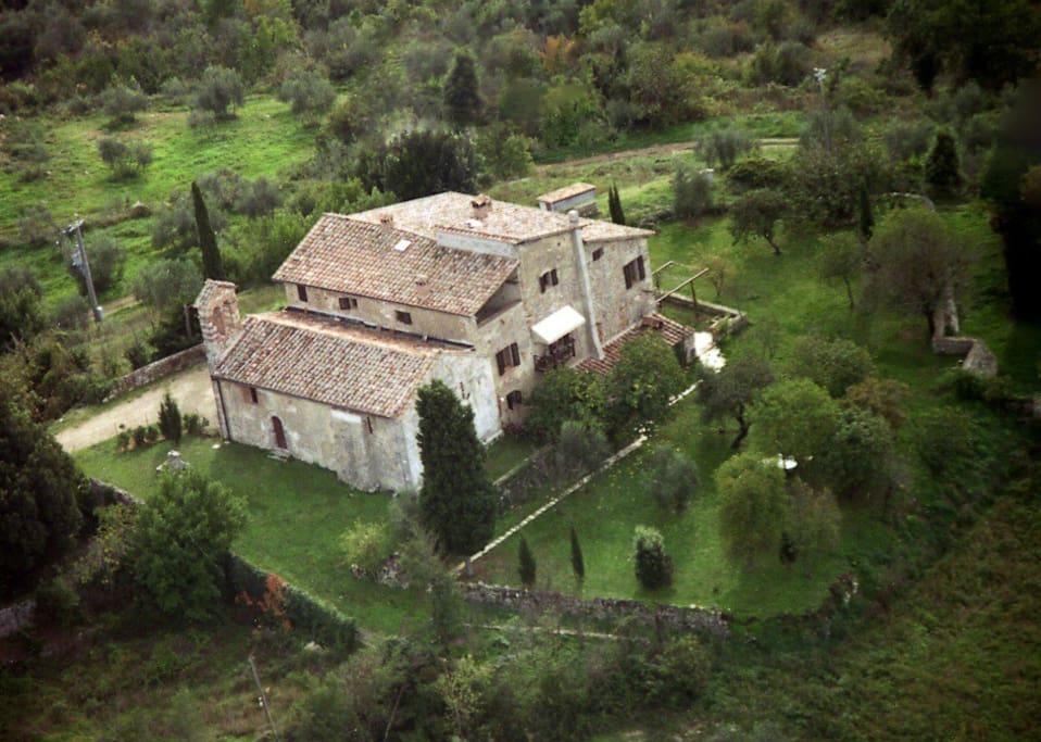 Air view: the rectory house with the church and garden