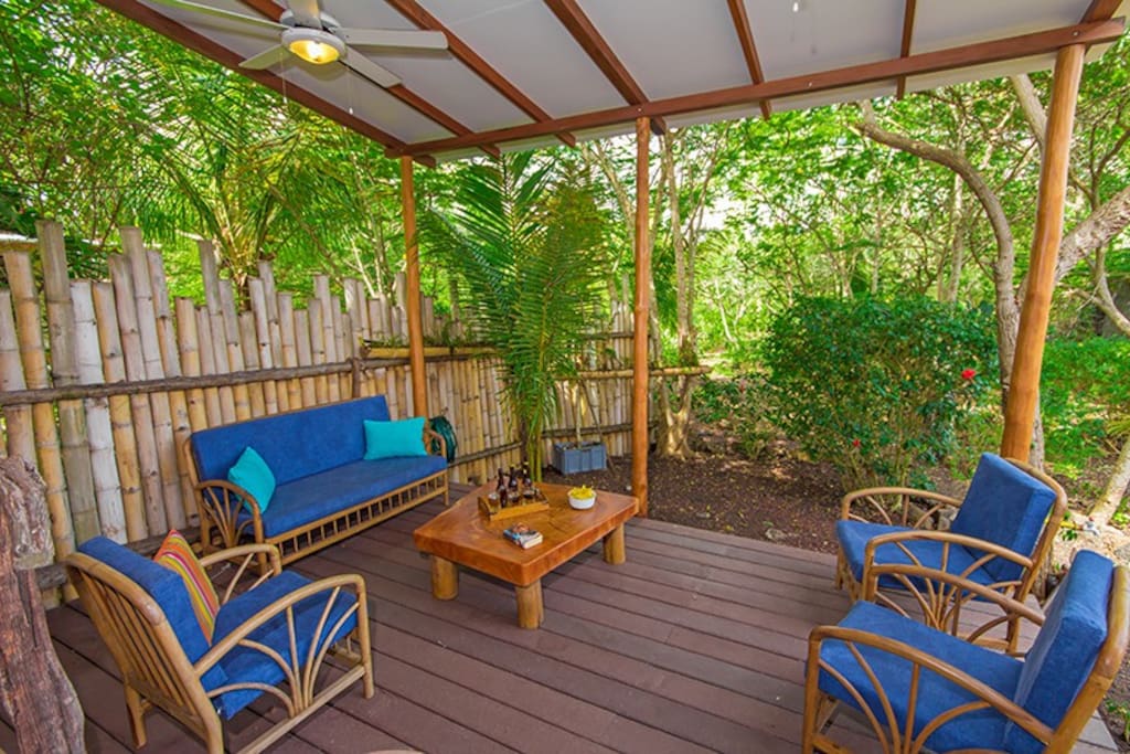 The covered patio - with seating area and fans