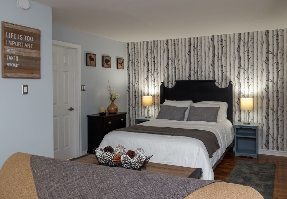 After a long day in the outdoors, relaxing is made easy in this comfy queen size bed in our Birches bedroom.