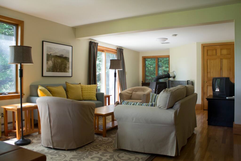 The cozy living room includes a game closet and a collection of music on CDs. Newly added: Netflix, Amazon and other streaming services on a larger TV than in this photo, a DVD player and DVDs.