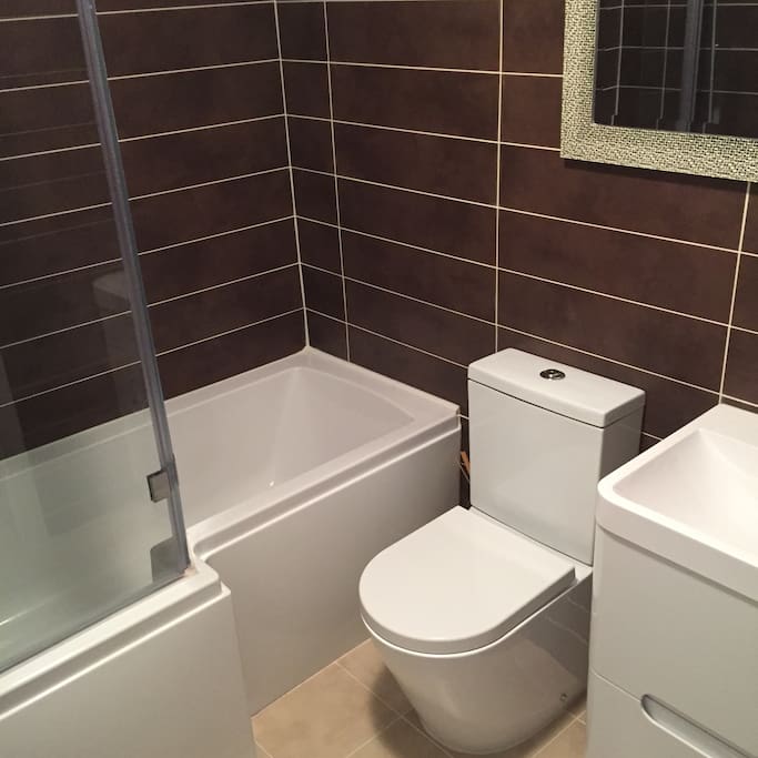 Newly fitted bathroom, large L shape shower bath & heated towel rail.