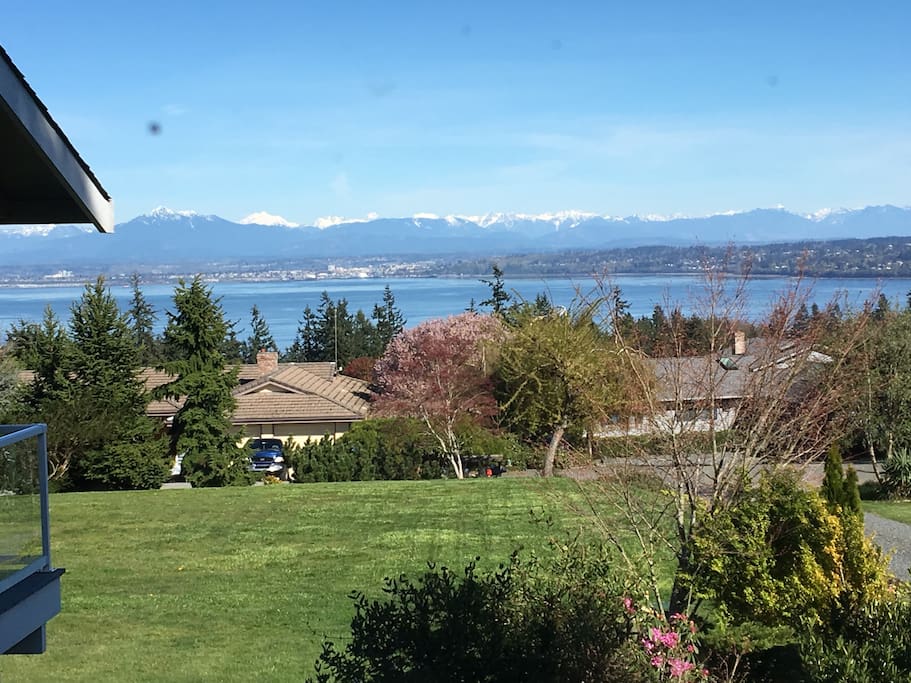 Eastern view of water and the Cascades Mountains right out your window. Great light all day.