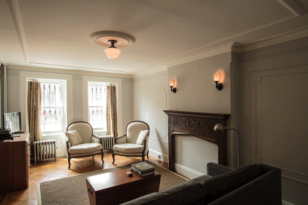 Spacious living room with beautiful details and cable tv.