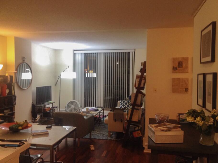 Living room with balcony. There is a TV that you can hook up to your computer.