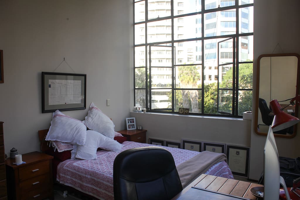 Your bed - the mattress is less than a year old, the quilt and pillow cases are organic and fair trade, and the view is absolutely stunning. The bedside table and a couple of other drawers are empty for you to use.