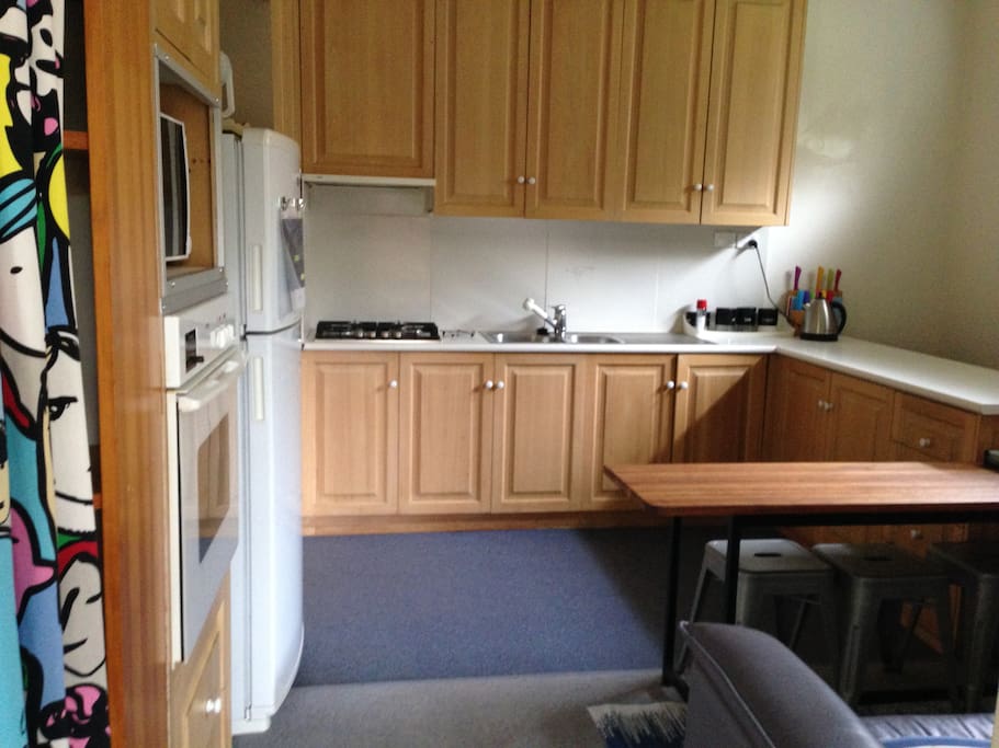 Large Kitchen with gas hotplates, electric oven, large fridge/freezer and plenty of seating.